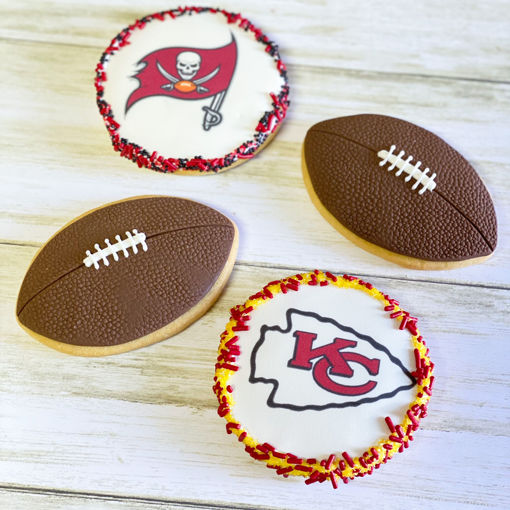 Super Bowl Decorated Sugar Cookies with football cookies, red and yellow Kansas city chief logo cookies and red and black Tampa bay buccaneer logo cookies