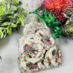 Bagged-White-Chocolate-Covered-Pretzels-with-red-and-green-sprinkles-and-bow